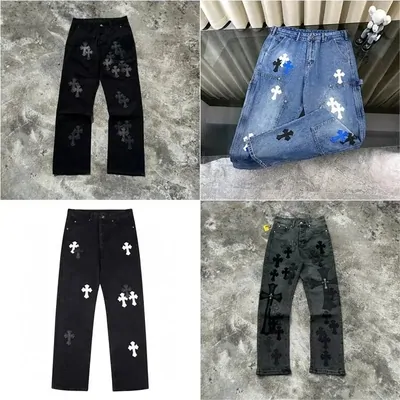 Four pairs of distressed cross-print jeans in black and light blue, photographed on a stone floor