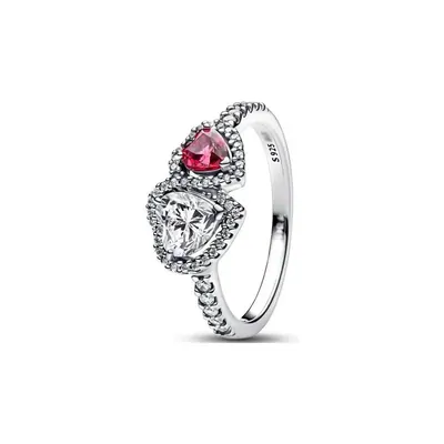 A silver ring set with a red heart-shaped stone and a row of small clear stones, on a white background