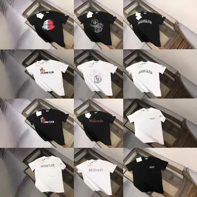 Twelve printed t-shirts in black, white and grey arranged in a four by three grid