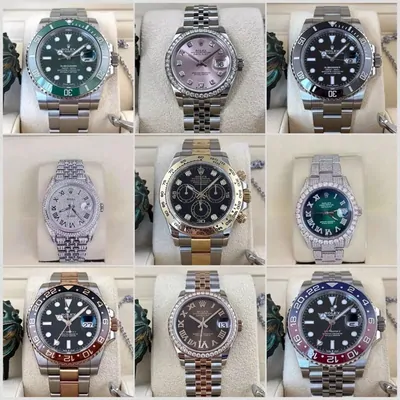Nine steel wristwatches with green, pink, black and blue dials, arranged in a three by three grid
